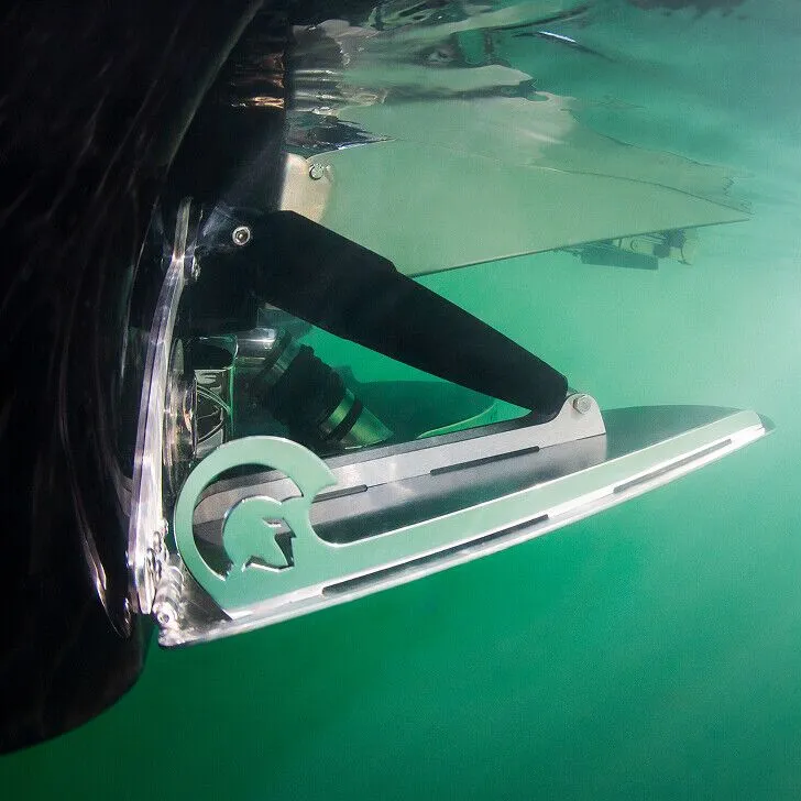 Close-up view of an underwater hydrofoil attached to a boat, with clear water and mechanical details visible.