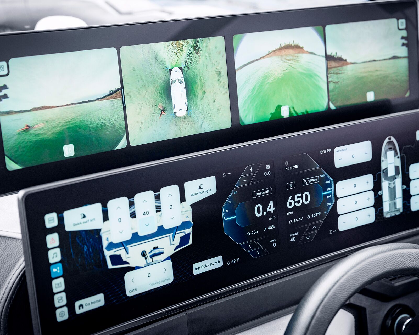 Dual digital displays show boat navigation data, system controls, and multiple camera feeds with aerial and rear views of a Centurion Nv Series Wake Boat on the water.