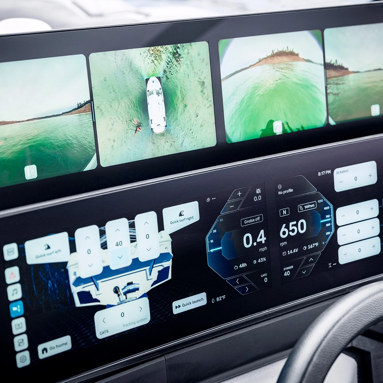 Dual digital displays show boat navigation data, system controls, and multiple camera feeds with aerial and rear views of a Centurion Nv Series Wake Boat on the water.