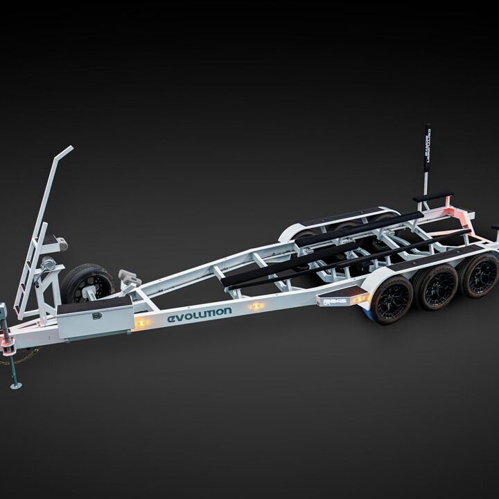 Triple-axle boat trailer with metal frame, tire mount, winch, and 