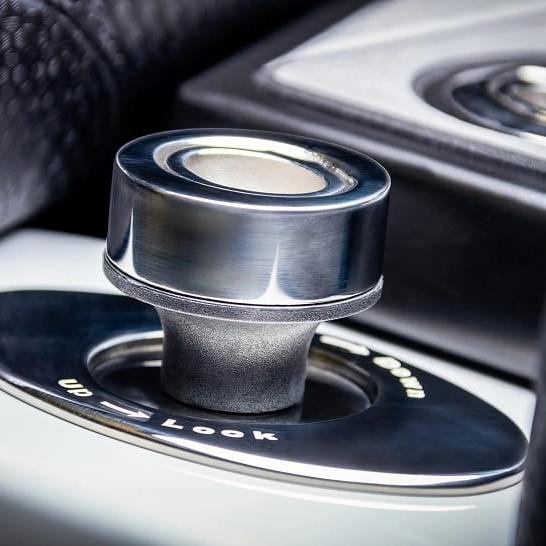 Close-up of a metallic Nv Series car gear selector knob with 