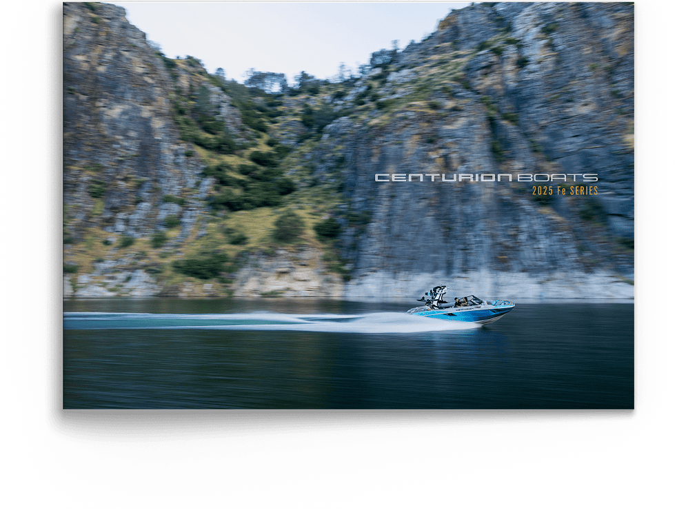 A blue Centurion boat speeds across a calm lake with rocky cliffs and trees in the background; text reads 