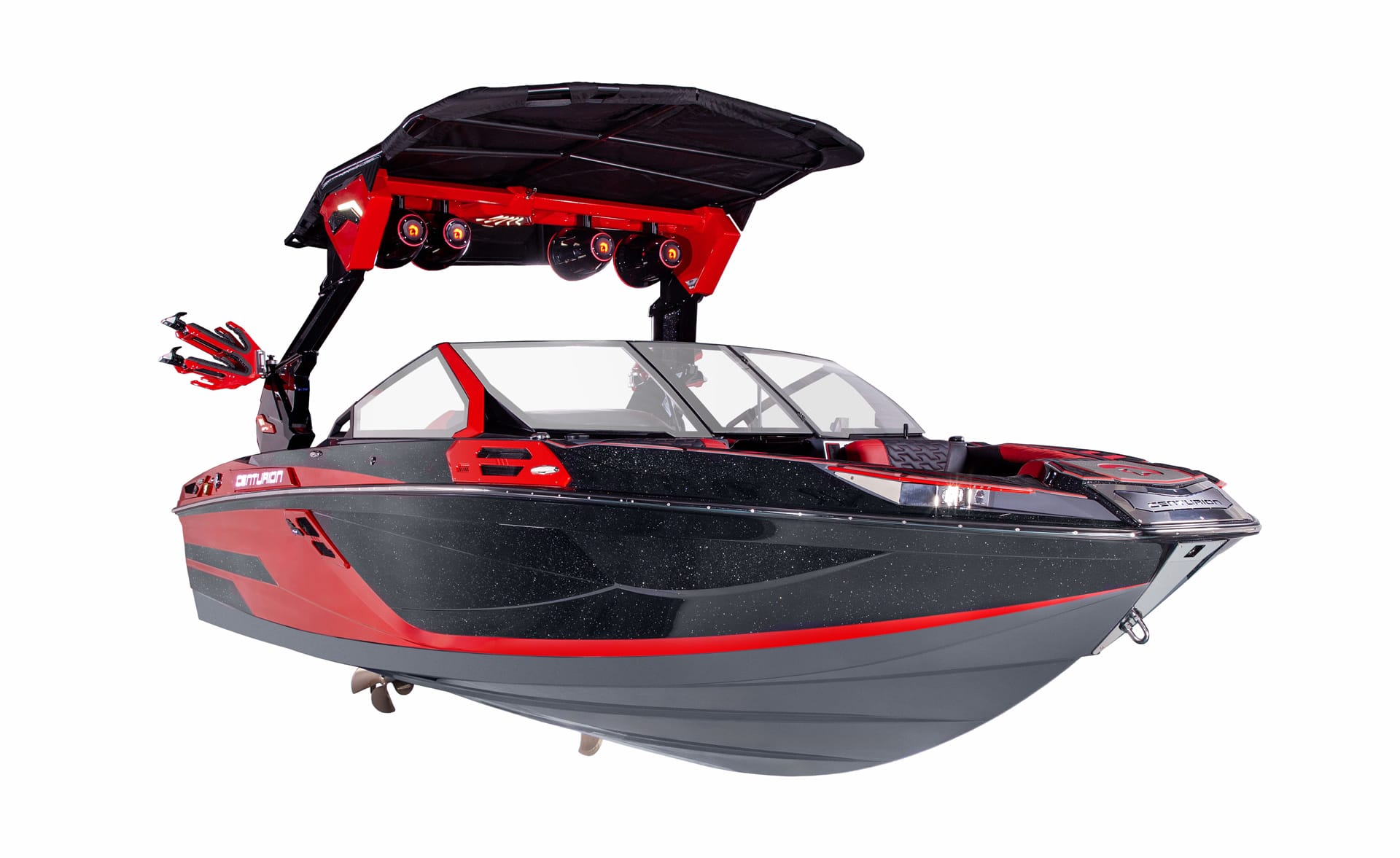 A black and red Centurion Ri230 speedboat with a wakeboard tower, speakers, and seating, viewed from the front-right side against a white background.