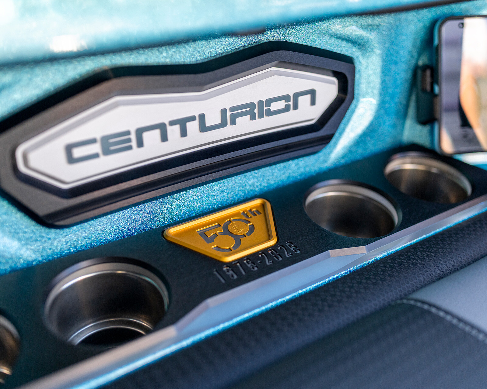 Close-up of a metallic panel on the Centurion Ri245 Surf Boat, featuring 