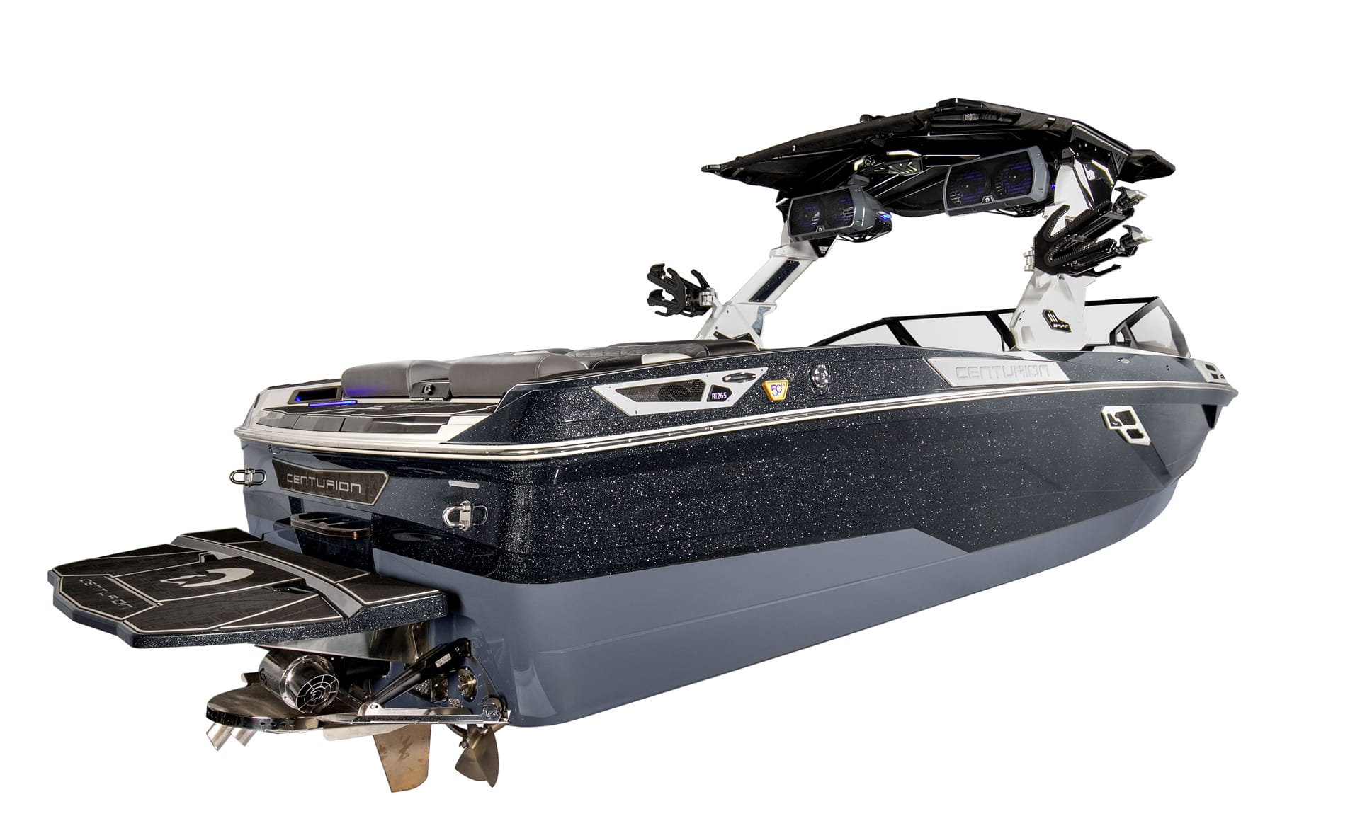 A modern, black and blue Centurion Ri265 Surf Boat with a wakeboard tower and swim platform, shown isolated on a white background.