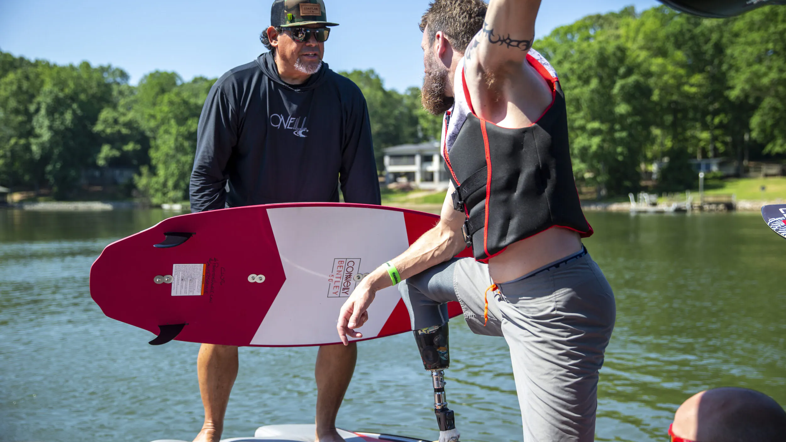 two athletes on back of boat