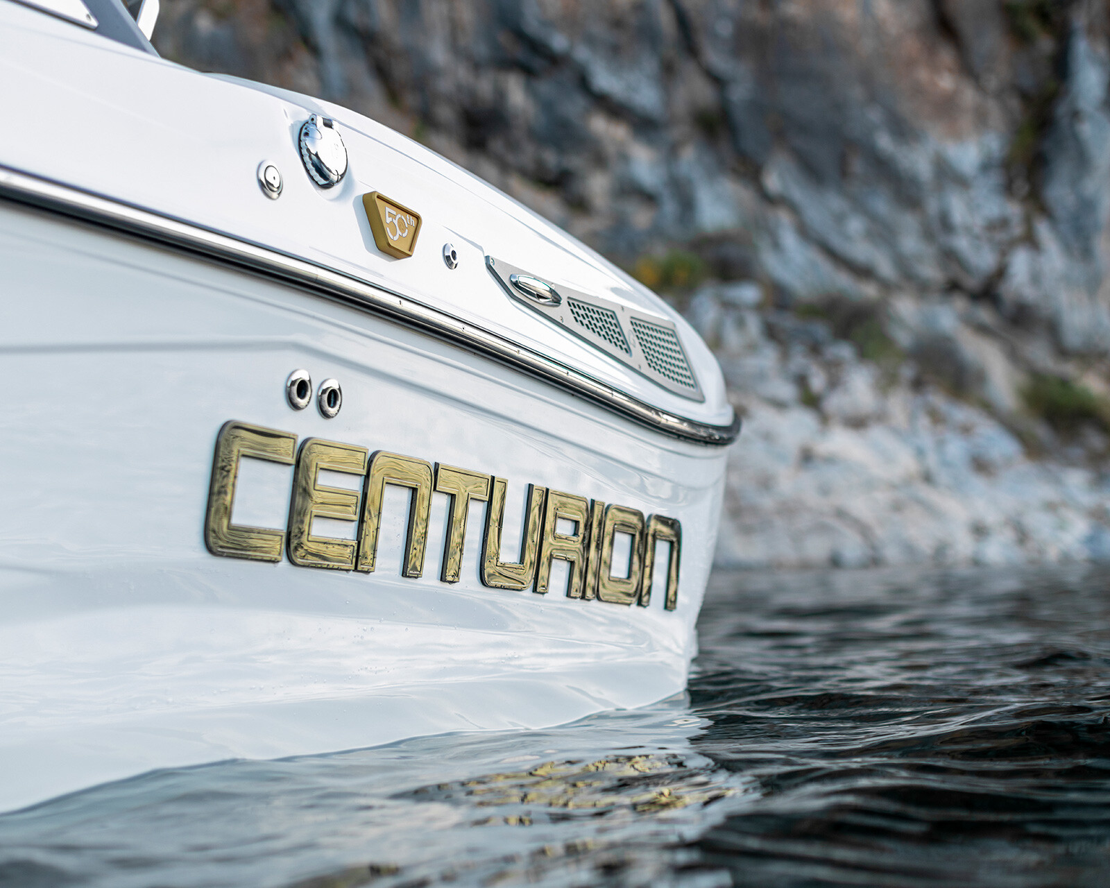 Close-up of a white Centurion Nv213 Wake Boat with