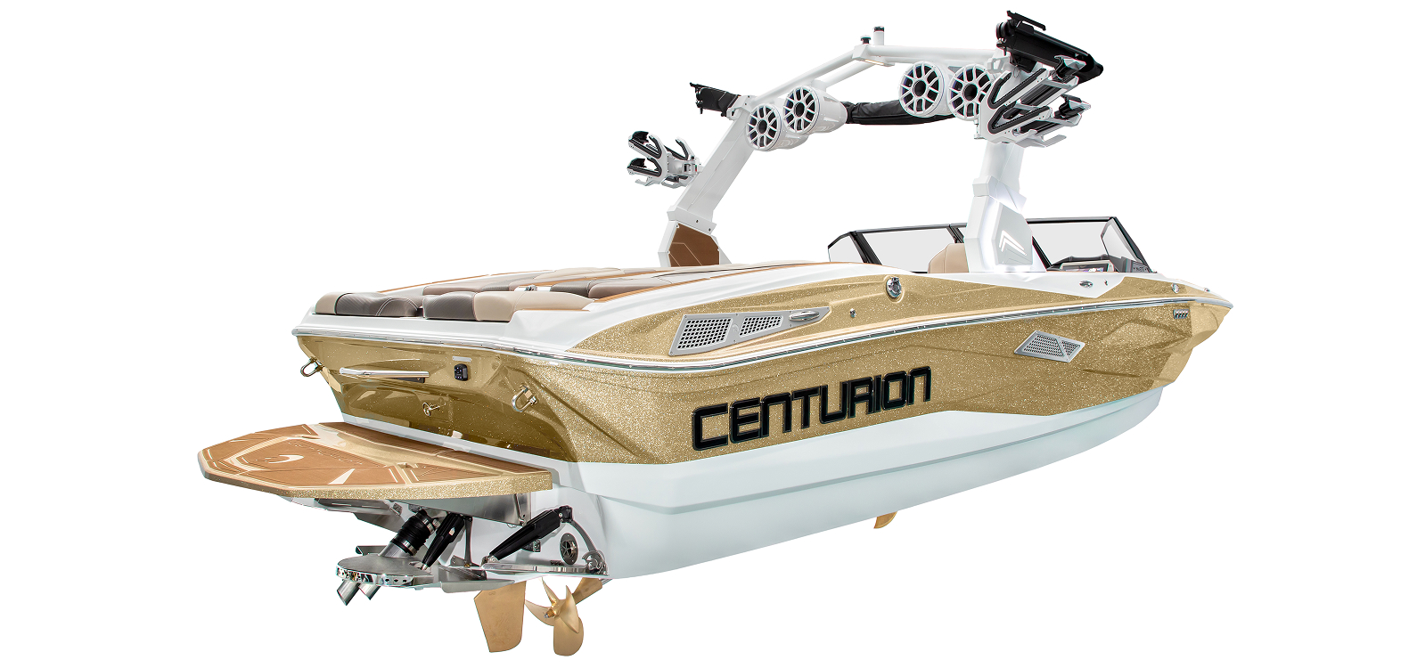 A gold and white Centurion Nv213 Surf Boat with a wakeboard tower, speakers, and seating area, viewed from the rear left side.
