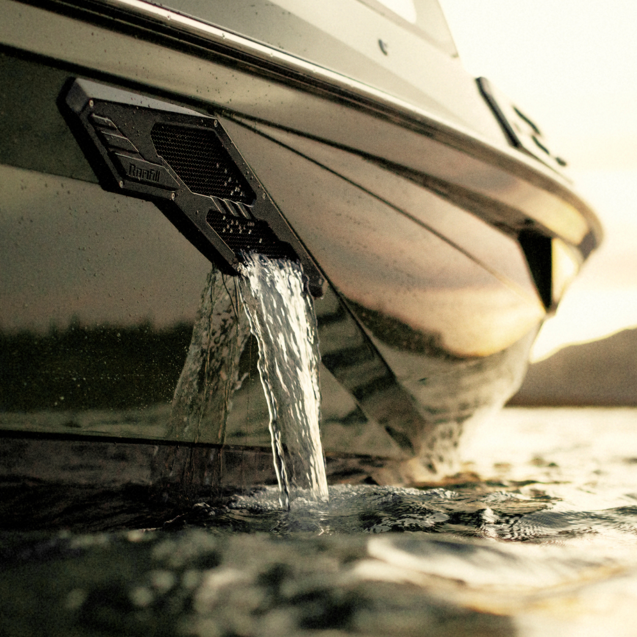 Close-up of water flowing out of a drainage outlet on the side of a boat floating on a calm body of water at sunset.