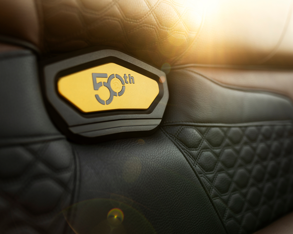 Close-up of a car seat featuring a black and yellow 