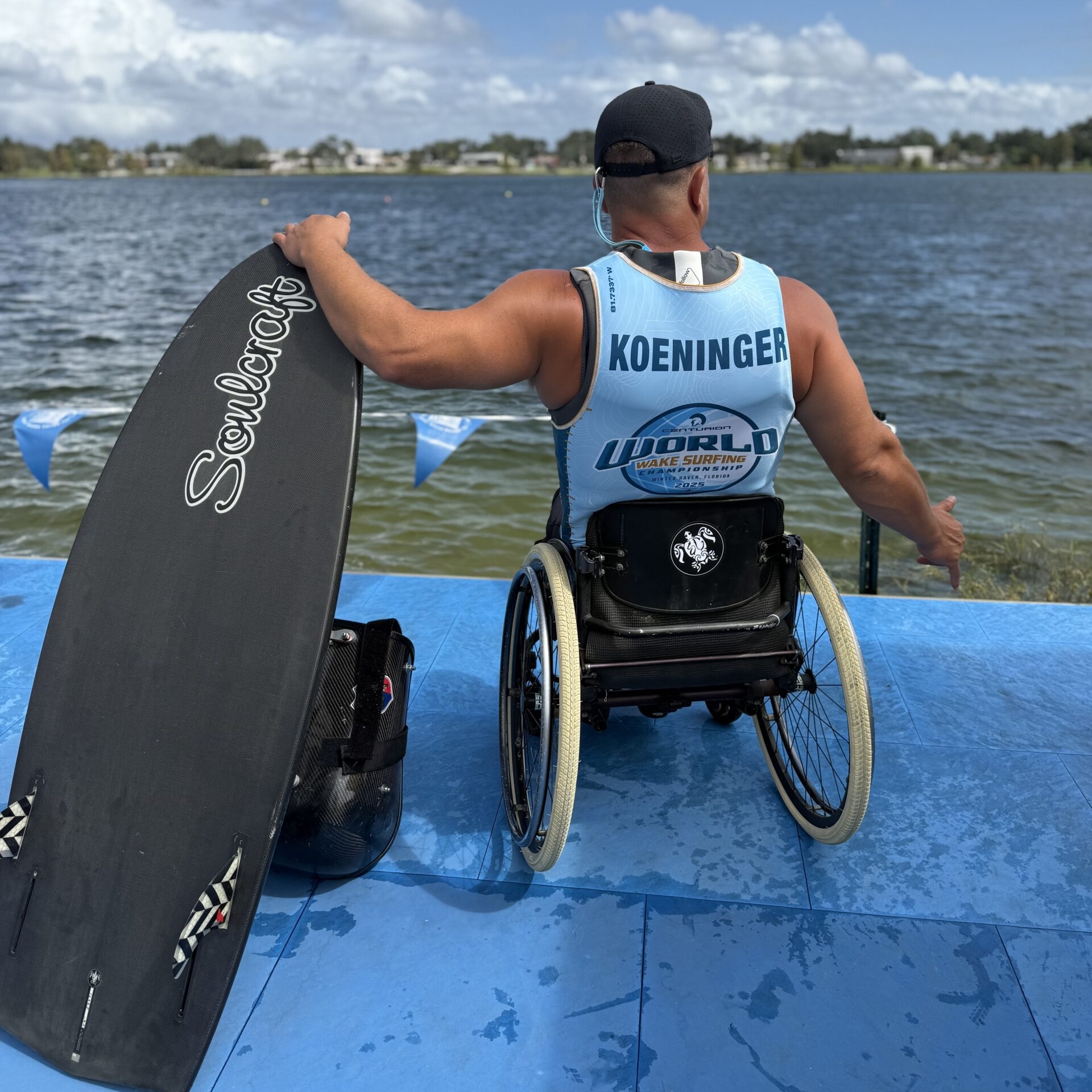 A man in a wheelchair wearing a 