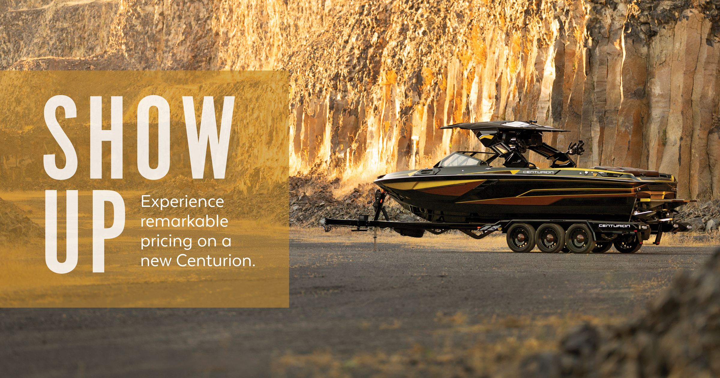 A black and yellow Centurion boat on a trailer is parked in front of a rocky cliff; promotional text appears on the left.