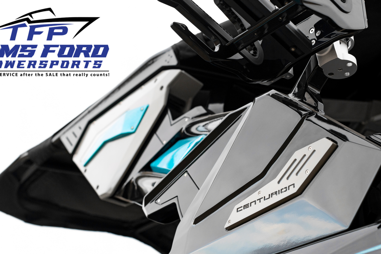 Close-up of a Centurion boat detail, with the Tims Ford Powersports logo and slogan in the top left corner.